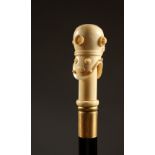 A BONE HANDLED WALKING STICK, carved as a divers helmet. 36.5ins long.