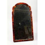 AN EARLY 20TH CENTURY TORTOISESHELL FRAMED STRUT/DRESSING TABLE MIRROR, with shaped top. 21.5ins x