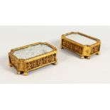 A GOOD PAIR OF 19TH CENTURY FRENCH ORMOLU STANDS, shaped rectangular, with mirrored top, the sides