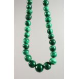 A MALACHITE BEAD NECKLACE, in excess of 600g, largest bead 1-inch (25mm), total length 42-inches (