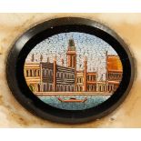 A MICRO MOSAIC OVAL PLAQUE, set in a rectangular marble block. 4.25ins wide.