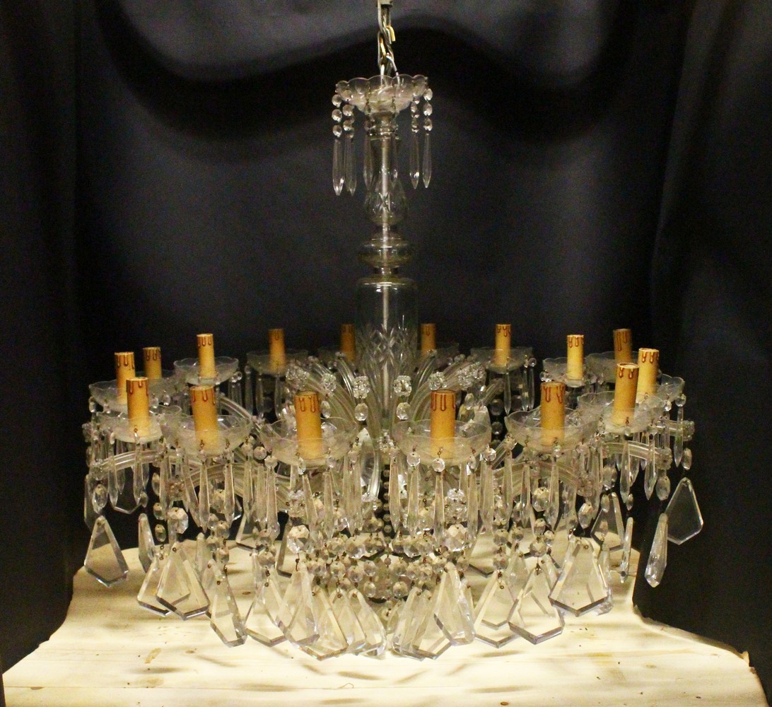 A GOOD LARGE CUT GLASS CHANDELIER, with baluster shape cut glass stem, sixteen small branches with