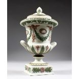 A SUPERB THREE COLOUR WEDGWOOD TWO-HANDLED URN AND COVER. 9ins high.