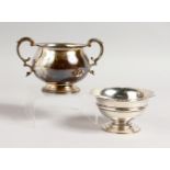 A CIRCULAR TWO-HANDLED SUGAR BASIN, London 1960, and A PEDESTAL SUGAR BOWL, London 1950 (2). Sugar