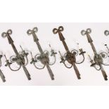 A GOOD SET OF EIGHT LOUIS XVI DESIGN METAL TWO-LIGHT WALL SCONCES, with scrolling branches and