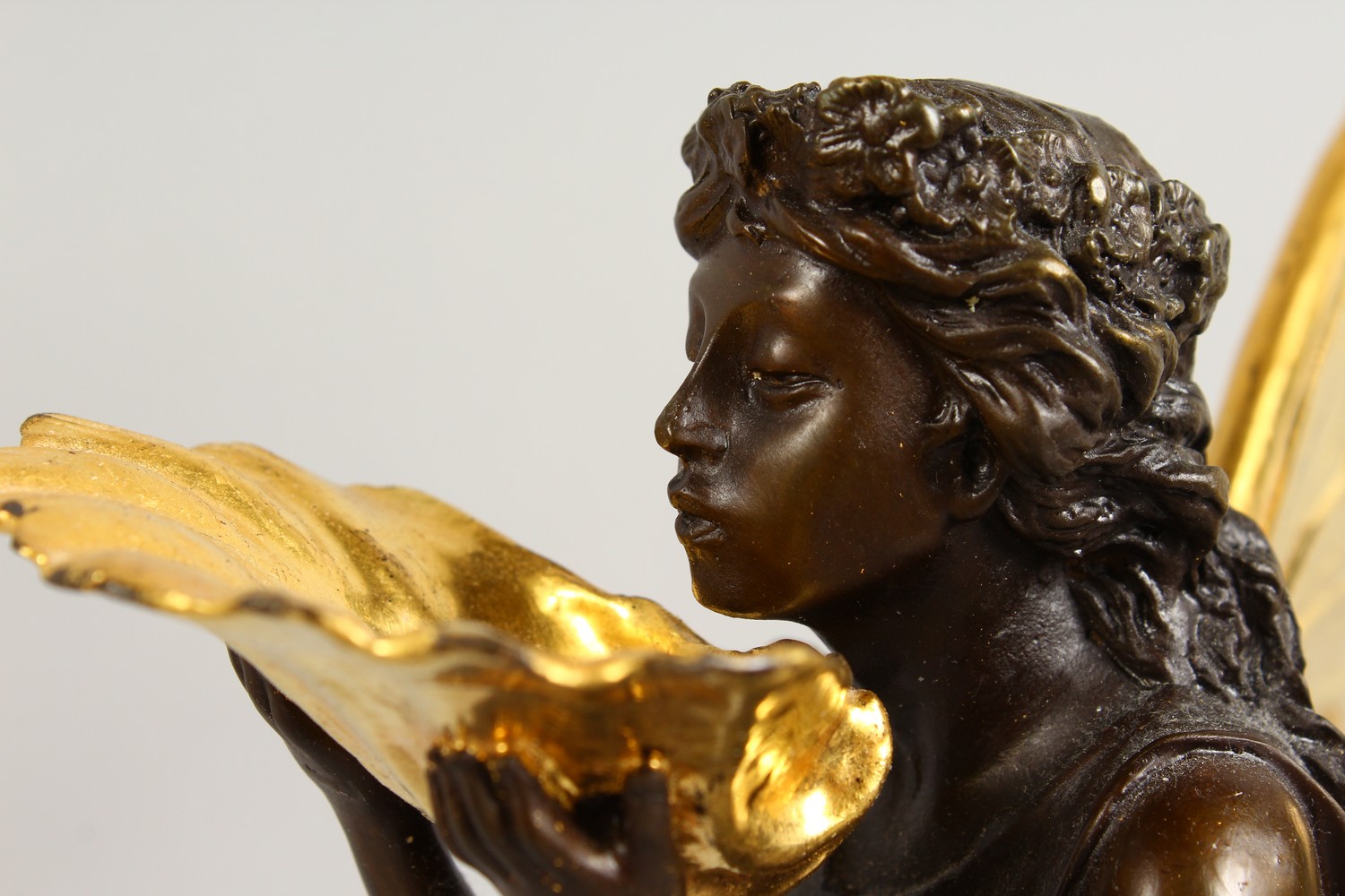 A BRONZE FIGURE OF A FAIRY, 20TH CENTURY, standing holding a shell in her hands, on a marble base. - Image 4 of 9