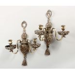 A PAIR OF SILVERED COPPER TWIN BRANCH CLASSICAL STYLE WALL APPLIQUES. 18.5ins high x 12ins wide.