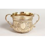 A GEORGE V TWO-HANDLED PORRINGER. London 1916. Maker: Goldsmiths & Silversmiths Co. Weight 10.5ozs.