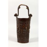 A REPLICAS OF A BRONZE MEDIEVAL VESSEL, with handle. 8.5ins high.