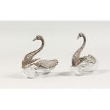 A PAIR OF CONTINENTAL SILVER SWAN SALTS. 5ins long.