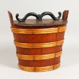 AN OAK OVAL BUCKET, with lid. 12ins wide.