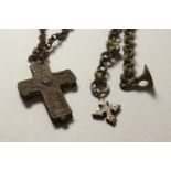 TWO BYZANTINE BRONZE CRUCIFIXES with chains. 1ins and 2ins high.