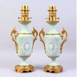A SUPERB PAIR OF 19TH CENTURY FRENCH PATE-SUR-PATE TWO-HANDLED URN SHAPED LAMPS, inset with a