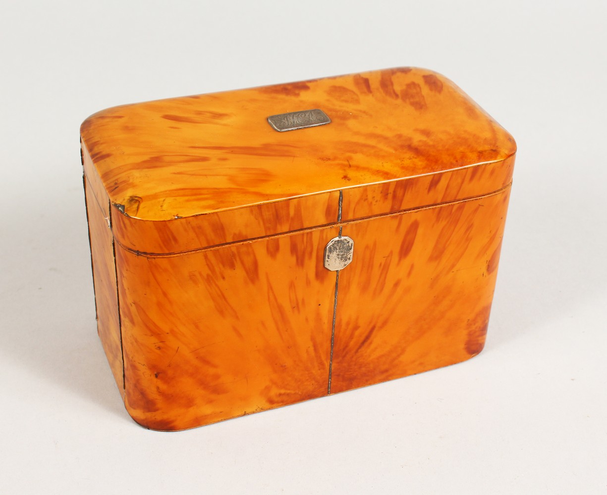 A GOOD GEORGE III BLONDE TORTOISESHELL TWIN COMPARTMENT TEA CADDY, with engraved silver plaque. 7ins