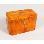 A GOOD GEORGE III BLONDE TORTOISESHELL TWIN COMPARTMENT TEA CADDY, with engraved silver plaque. 7ins