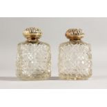 A PAIR OF CUT GLASS SCENT BOTTLES, with silver top. Birmingham 1900.