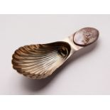 A GEORGE III SHELL CADDY SPOON. Maker: N.S. & Co.