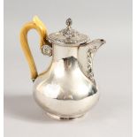 A FRENCH SILVER COFFEE POT, with ivory handle, with Earls coronet and crest.