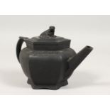 A CHINESE DESIGN BLACK BASALT OCTAGONAL TEAPOT AND COVER with kylin handle. 4ins wide.