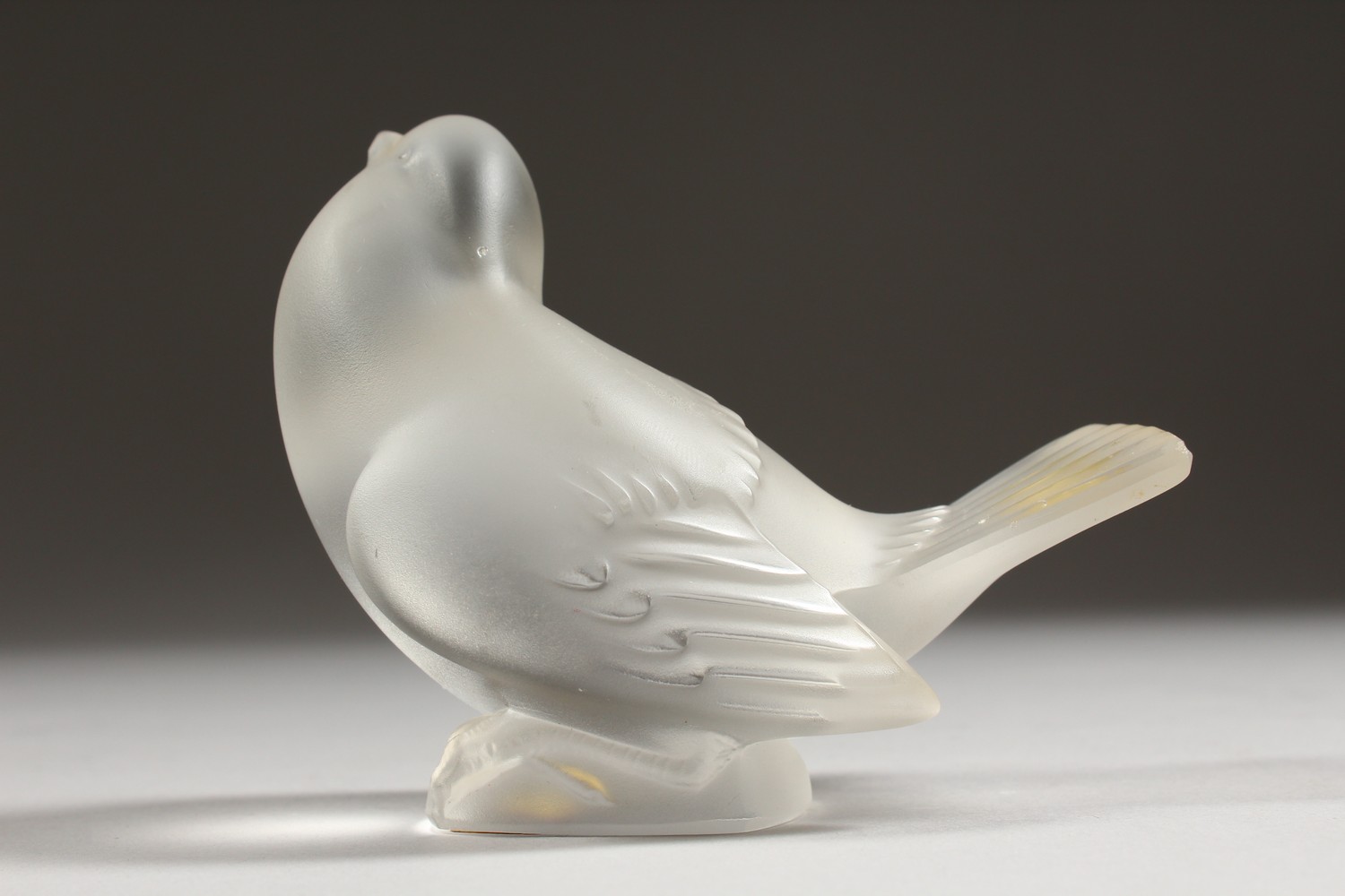 A LALIQUE FROSTED GLASS MODEL OF A BIRD, seated with folded wings, (small tail chip). 4ins long. - Image 4 of 8