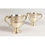 A PAIR OF GEORGE II TWO-HANDLED CUPS, with acanthus handles. London 1755. Maker: Fuller White.