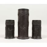 A PAIR OF WEDGWOOD BLACK BASALT SPILL VASES, with classical scenes, Impressed WEDGWOOD, 4ins high,