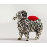 A NOVELTY SILVER RAM PIN CUSHION.