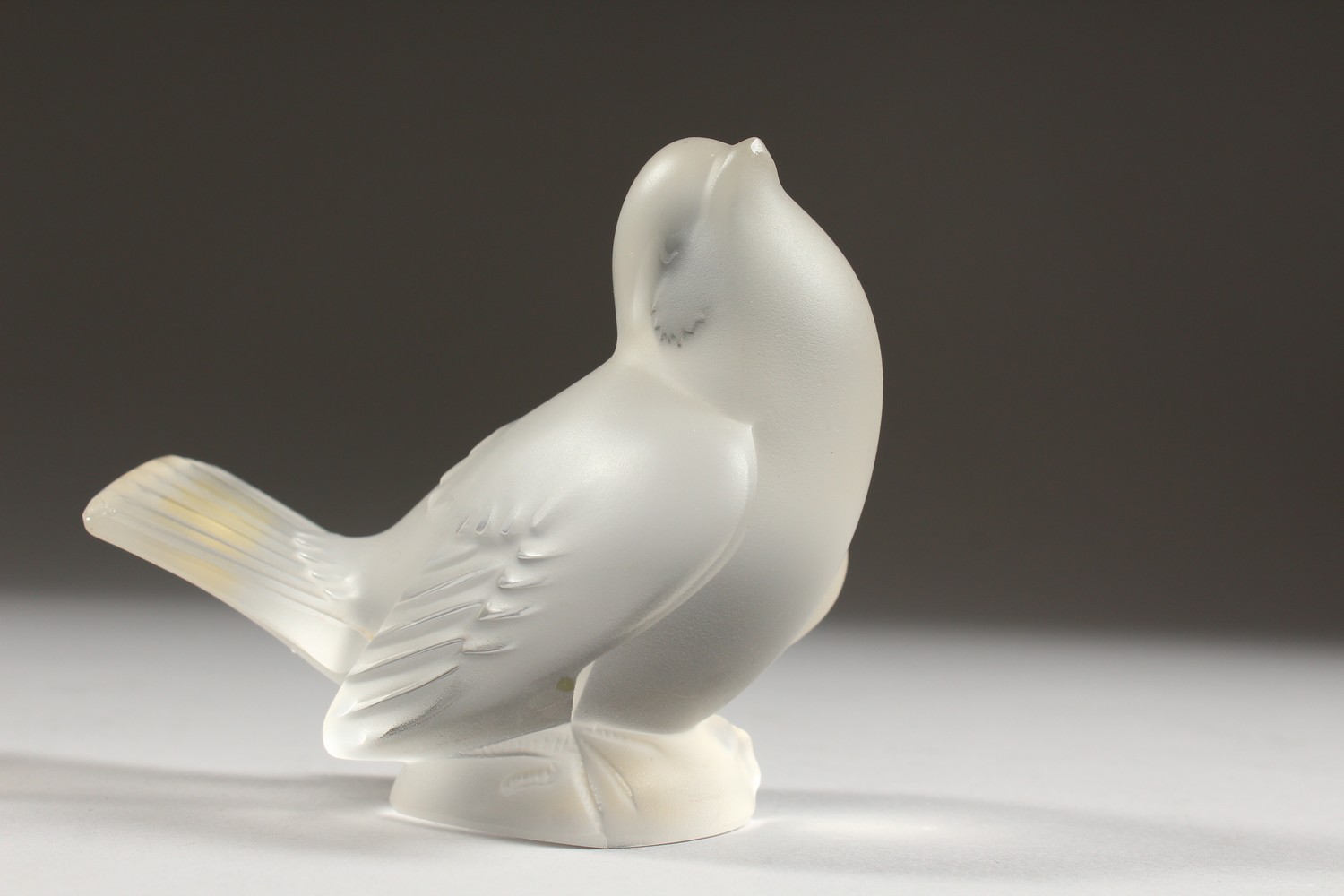 A LALIQUE FROSTED GLASS MODEL OF A BIRD, seated with folded wings, (small tail chip). 4ins long. - Image 2 of 8