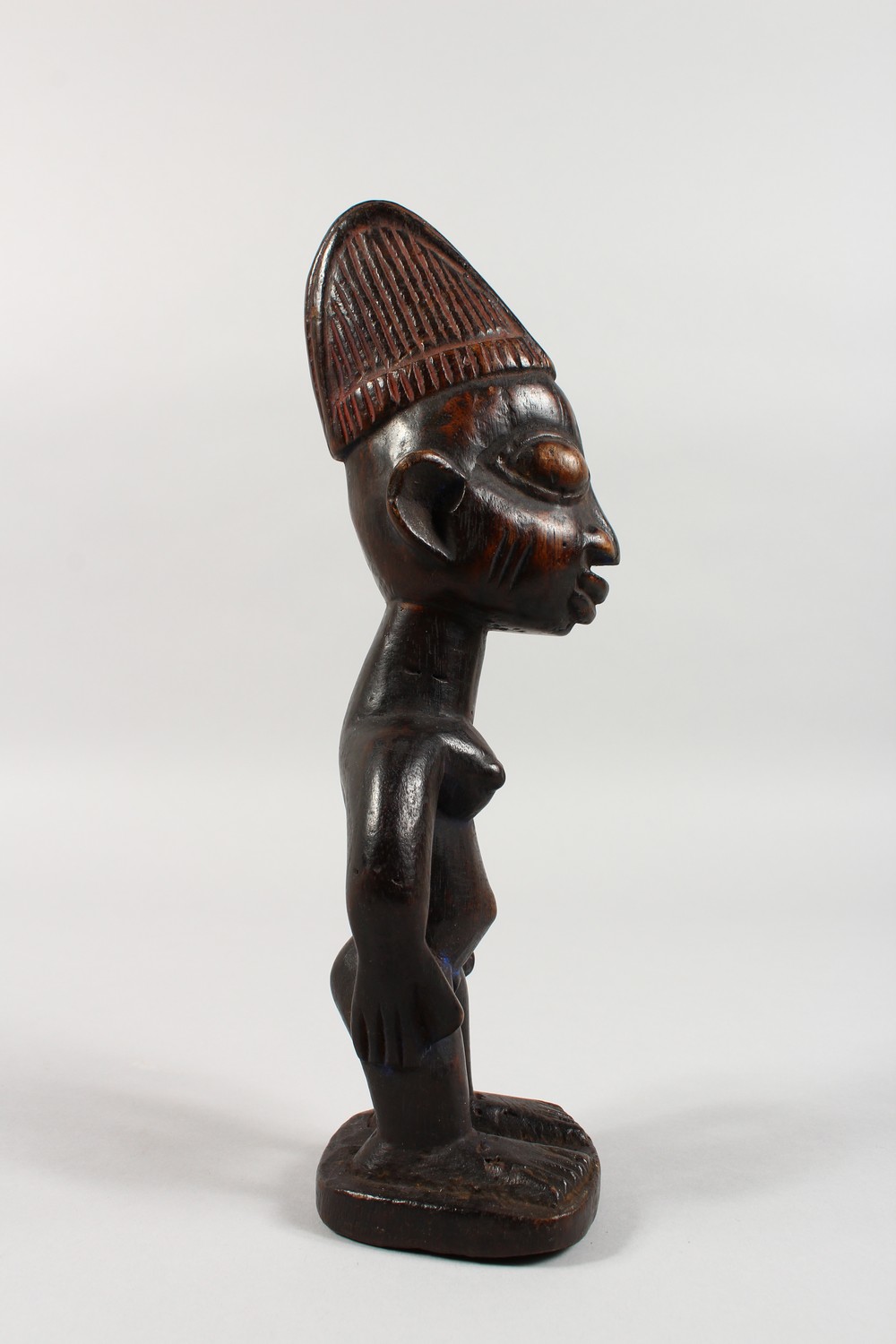 AN YORUBA TRIBE CARVED WOOD STANDING FEMALE FIGURE, with traces of original pigment. 11ins high. - Image 2 of 5