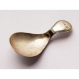 A GEORGE III SHELL CADDY SPOON.