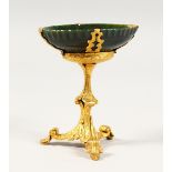 A GOOD FRENCH GREEN-STONE OVAL DISH, on a gilded metal stand. 4ins high.