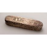 A LONG VICTORIAN SILVER BOX, repousse decoration with figures in a landscape. 6.75ins long. London