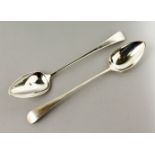 A PAIR OF GEORGE III LONG HANDLED SERVING SPOON. London 1807. Maker: Peter and William Bateman. 31cm