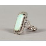 A 9CT GOLD, OPAL AND DIAMOND RING.