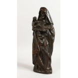 A 19TH CENTURY BRONZE OF MADONNA, holding two children and a book in her arms. 13.5ins high.