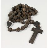 A ROSARY BEAD NECKLACE.