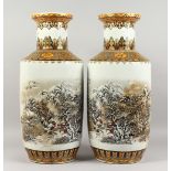 A LARGE PAIR OF REPUBLICAN STYLE VASES, decorated with a snowy white landscape. 25ins high.
