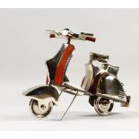 AN UNUSUAL CHROME AND LEATHER MODEL OF A SCOOTER. 11ins long.