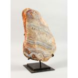 A MINERAL SAMPLE, cut and polished, on a stand. 11.5ins x 7.5ins.