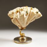 AN UNUSUAL WHITE CORAL SCULPTURE, mounted with gilt metal crustaceans, on a dolphin support with