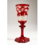 A GOOD LARGE 19TH CENTURY BOHEMIAN RUBY GLASS PEDESTAL GOBLET, engraved with deer in a wooded
