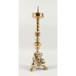AN 18TH/19TH CENTURY CAST BRASS PRICKET STYLE CANDELABRA, on three claw and ball feet. 1ft 7ins