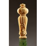 A FINE 18TH CENTURY, POSSIBLY FRENCH, SPINACH JADE PAGE TURNER, with carved ivory handle. 11ins