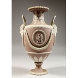A WEDGWOOD LILAC JASPER WARE TWO-HANDLED URN SHAPED VASES, with mask handles, garlands and