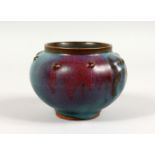 A CHINESE POTTERY CENSER, with purple splash decoration. 5ins wide.