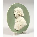 A WEDGWOOD GREEN AND WHITE OVAL JASPER WARE PORTRAIT PLAQUE. Impressed WEDGWOOD. 4.5ins x 3.5ins.