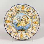 A LARGE ITALIAN POLYCHROME CIRCULAR CHARGER, seahorses and figures. 16ins diameter.