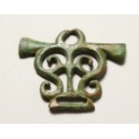 A ROMAN PIERCED BRONZE AMULET/BUCKLE. 3ins wide.