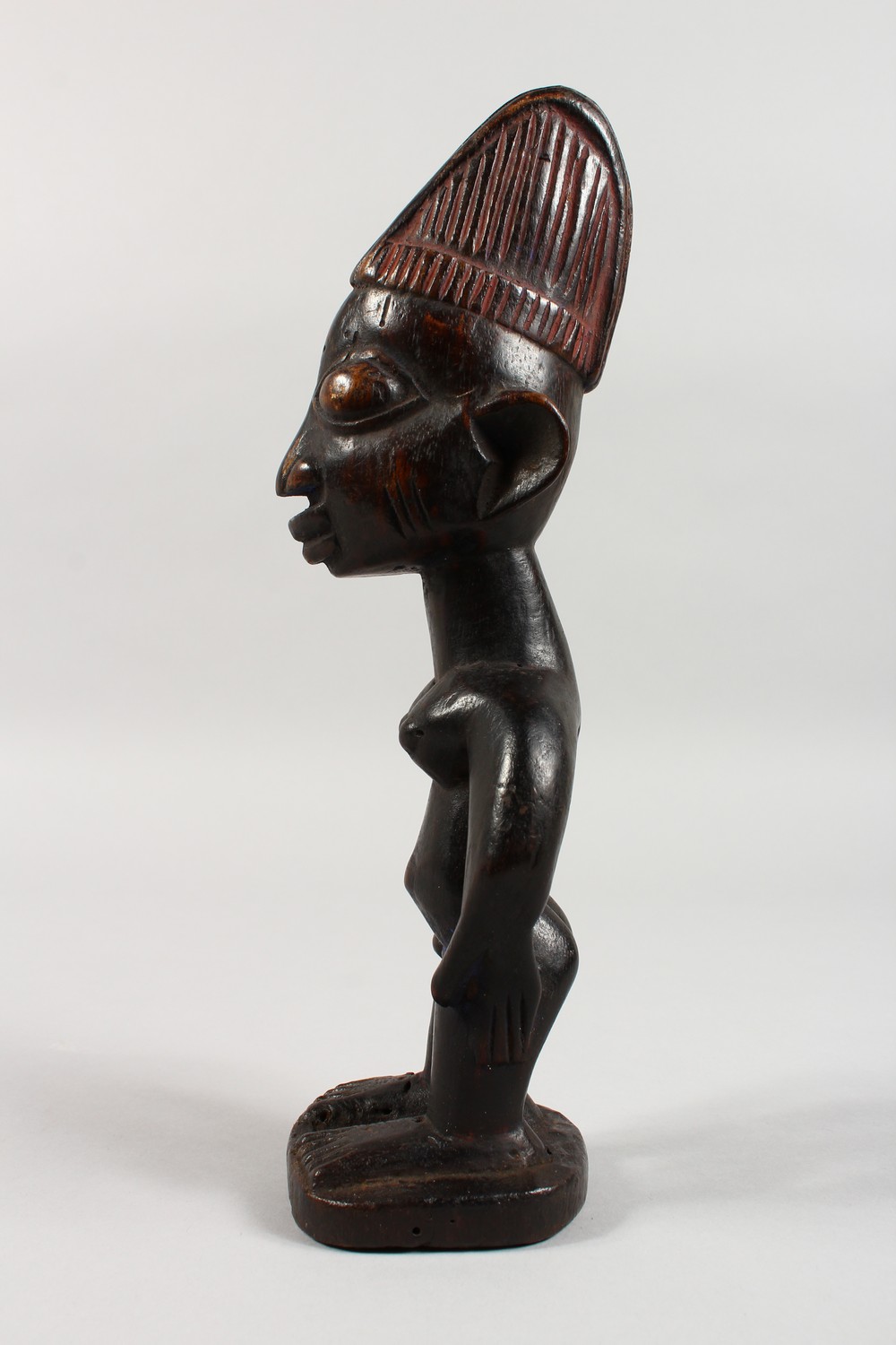 AN YORUBA TRIBE CARVED WOOD STANDING FEMALE FIGURE, with traces of original pigment. 11ins high. - Image 4 of 5