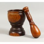 A 19TH CENTURY LIGNUM VITAE PESTLE AND MORTAR. Mortar: 7ins high.